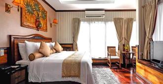 Red Coconut Beach Hotel - Boracay - Schlafzimmer