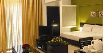 Royal Orchid Golden Suites Pune - ปูเน่ - ห้องนอน
