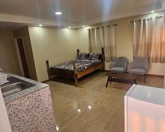 Lion's Guest House in Warner - Mahaut - Schlafzimmer