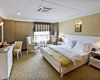 Hotel Gargee Grand - Patna - Yatak Odası