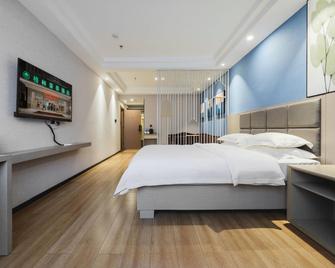 Greentree Inn Jiangxi Ganzhou Municipal Government Business Hotel - Ganzhou - Bedroom