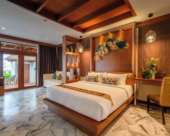 رايلي باي ريزورت آند سبا - كرابي - غرفة نوم