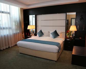 The Olive Hotel - Manama - Schlafzimmer