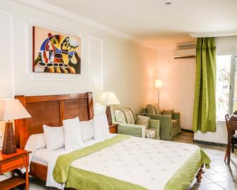 Tchero Hotel - Douala - Ložnice