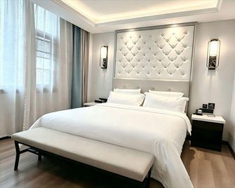 Xana Hotelle (Luoyang Shizi Street Luoyi Ancient City) - Luoyang - Bedroom