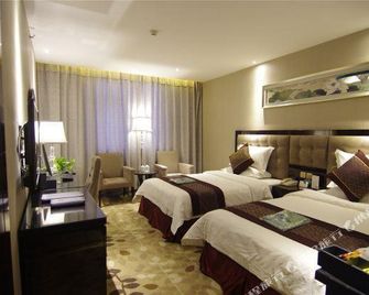 Xuchang Blue Coast Holiday Inn - Xuchang - Bedroom