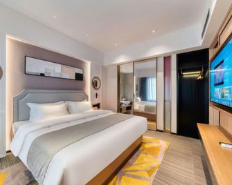 Yike Yijia Hotel (Dalian Donggang Business District Gangwan Square Metro Station) - Dalian - Schlafzimmer