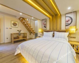 Yunsu Snow Mountain View Boutique Inn - ליז'יאנג - חדר שינה