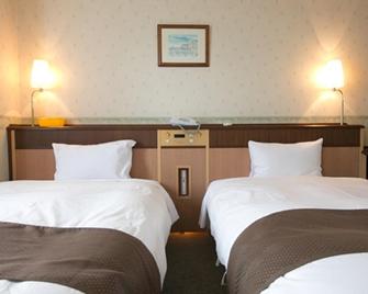 Royal Inn Sendai - Satsumasendai - Спальня