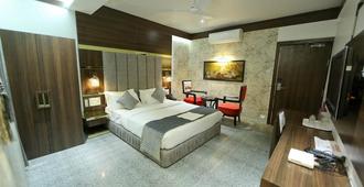 Hotel President - נגפור - חדר שינה