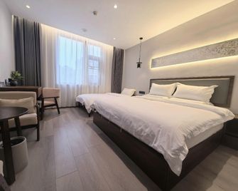 Songzeyue Residence Hotel (Nanjing Hongshan Zoo Branch) - Nanjing - Bedroom