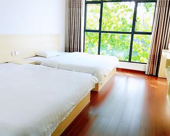 Dong Jiang Hu Xiang Cun Da Wan Cai Hotel - Chenzhou - Schlafzimmer