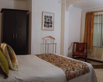 Hotel Makroz Colonial - Latacunga - Habitación