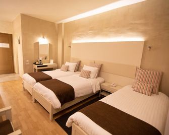 نيديموس هوتل - دلفي - غرفة نوم