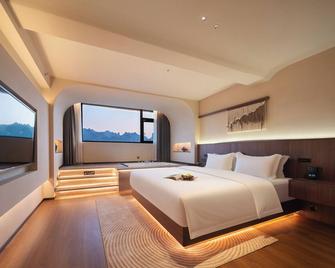 Zhangjiajie Yujie Hotel - Zhangjiajie - Bedroom