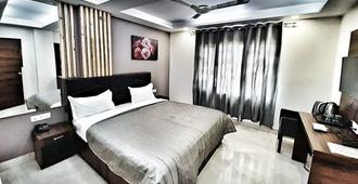 Hotel Delhi Aerocity - New Delhi - Slaapkamer
