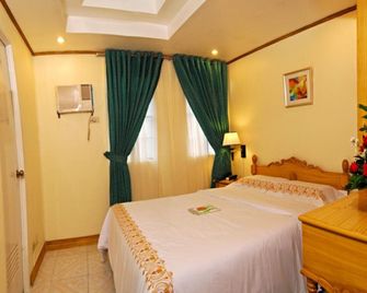 Ormoc Sugarland Suites - Ormoc - Schlafzimmer