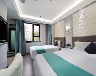 Xana Hotel (Qingdao Business District Shandong Road Branch) - Qingdao - Habitación