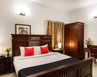 Capital O 40286 Lush Garden Resort - Covelong - Habitación