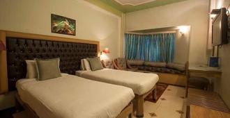 Hotel Samrat international - Patna - Yatak Odası