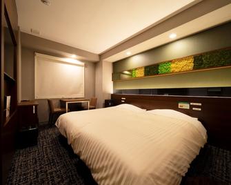 Super Hotel Ehime Ozu Inter - Ōzu - Camera da letto