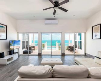 Get Ready for Ocean Views, Pool, and Beach Fun - Providenciales - Living room