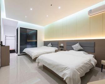 Bowen Elegant Hotel (Dunhuang Night Market Shop) - 酒泉 - 臥室