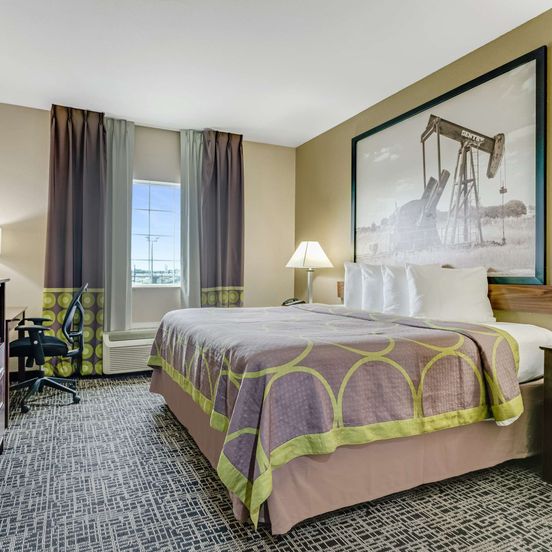 Bedroom view of SureStay Plus Hotel by Best Western Owasso Tulsa North