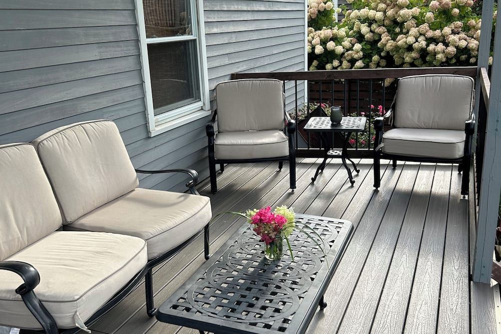 Balcony view of 2bed/2bath with water views, large deck, walking distance to beach/restaurants