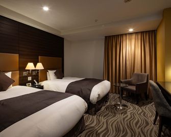 هوتل متروبوليتان تاكاساكي - تاكاساكي - غرفة نوم