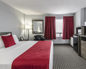 Paradise Inn & Conference Centre - גרנד פריירי - חדר שינה