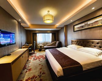 Wanjia Oriental Hotel - שיאמן - חדר שינה