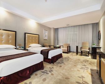 Xuchang Blue Coast Holiday Inn - Xuchang - Bedroom
