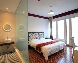 Beijing Drum Tower Youth Hostel - בייג'ין - חדר שינה