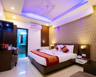 Hotel Surya International - Niu Đê-li - Phòng ngủ