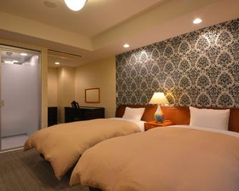 نيكو ستيشن هوتل كلاسيك - نيكو - غرفة نوم