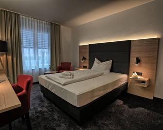 Hotel & Apart4you - Dorfen - Schlafzimmer
