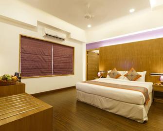 Medora Hotel - Kozhikode - Bedroom