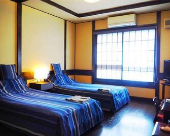Tamachi Bukeyashiki Hotel - Semboku - Bedroom