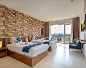 Hoi An Aurora Riverside Hotel and Spa - Hội An - Schlafzimmer