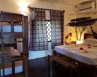 Boutique Hotel Nyumbani Tembo - Watamu - Спальня