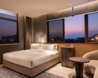 Four Seasons Aesthetics Hotel (Wanda Plaza Branch) - Dongfang - Bedroom