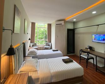 Royal Kencana Hotel powered by Cocotel - Jepara - Slaapkamer