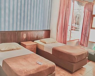 RedDoorz Syariah Near Pasar Pagi Samarinda - Samarinda - Slaapkamer