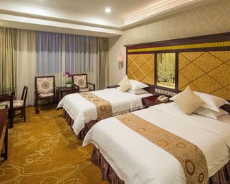 Jinyatai Business Hotel - Cantón - Habitación