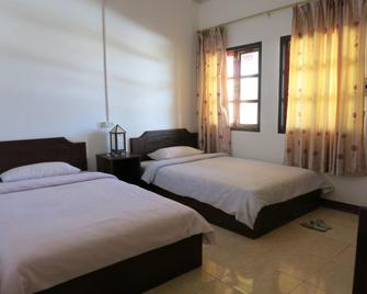 Jennida Guesthouse - Phonsavan - Habitación
