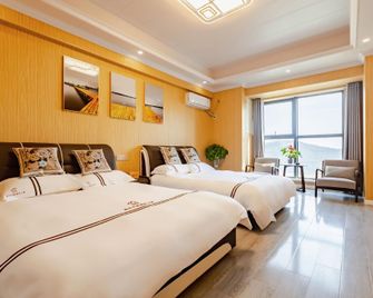 Nanjing E Nationality Apartment (Xianlin University Town Wanda Mao) - نانجينغ - غرفة نوم