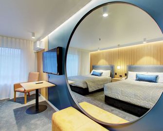 فندق ومركز مؤتمرات ديستينكشان وانغاري - وهانغاري - غرفة نوم