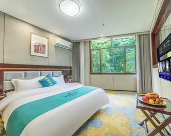 Riyue International Hotel - Qiandongnán - Habitación