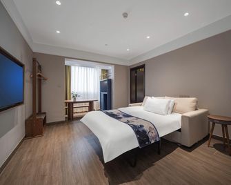 Grand Cozy Hotels - Nanjing - Slaapkamer